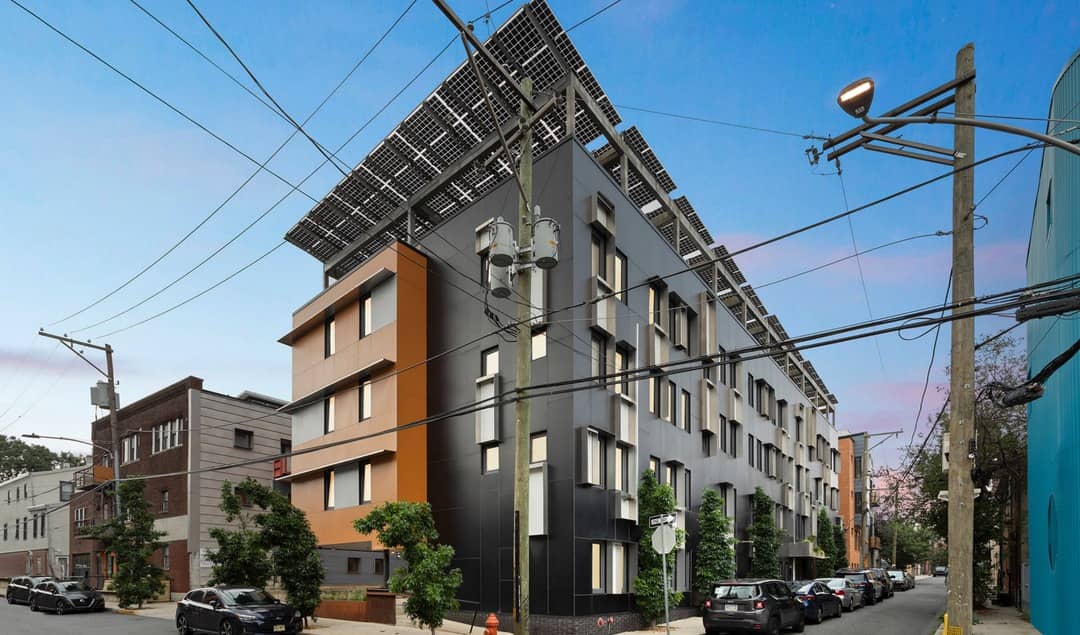 Capital Flats building with black and rust colored exterior Capital Flats building with black and rust colored exterior